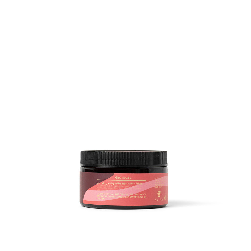 Siden af en sort krukke As I Am Long & Luxe GroEdges (113 g) med en lyserød etiket, der viser produktnavnet og en del af beskrivelsen.