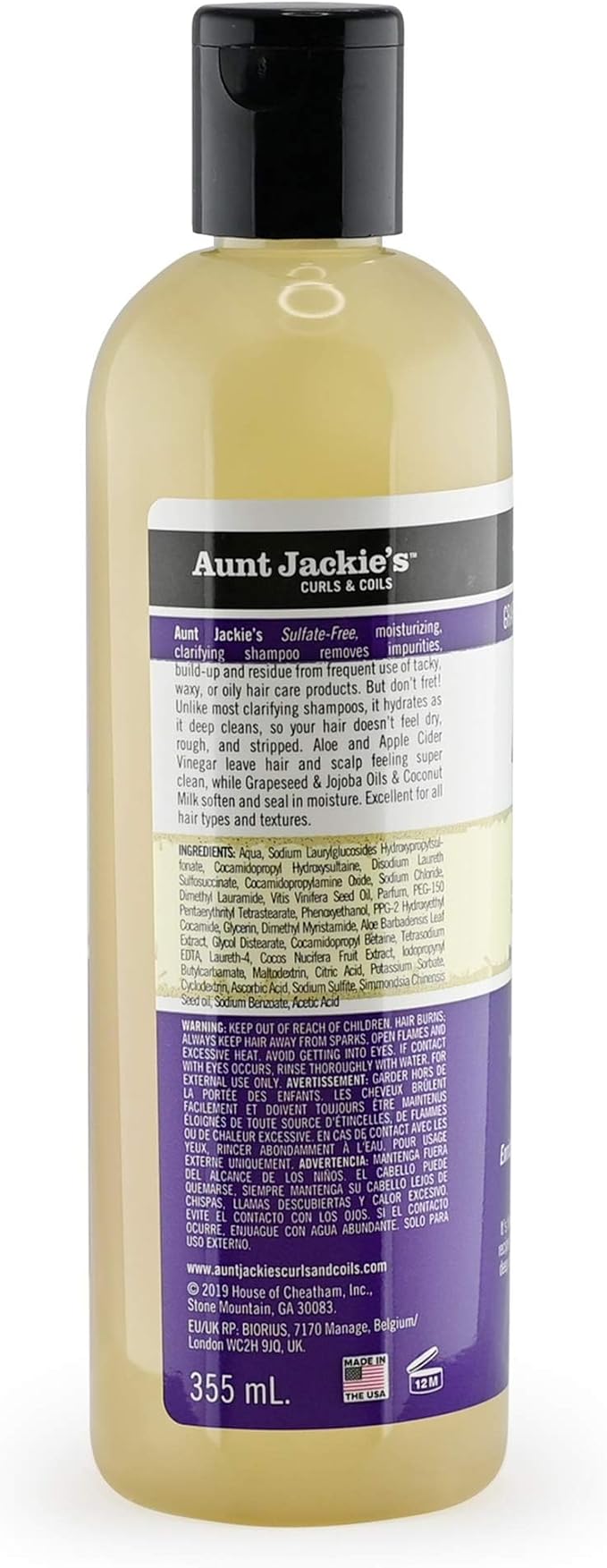 Bagsiden af en klar flaske Aunt Jackie's Power Wash Intense Moisture Clarifying Shampoo med sort låg. Viser ingrediensliste og brugsanvisning.