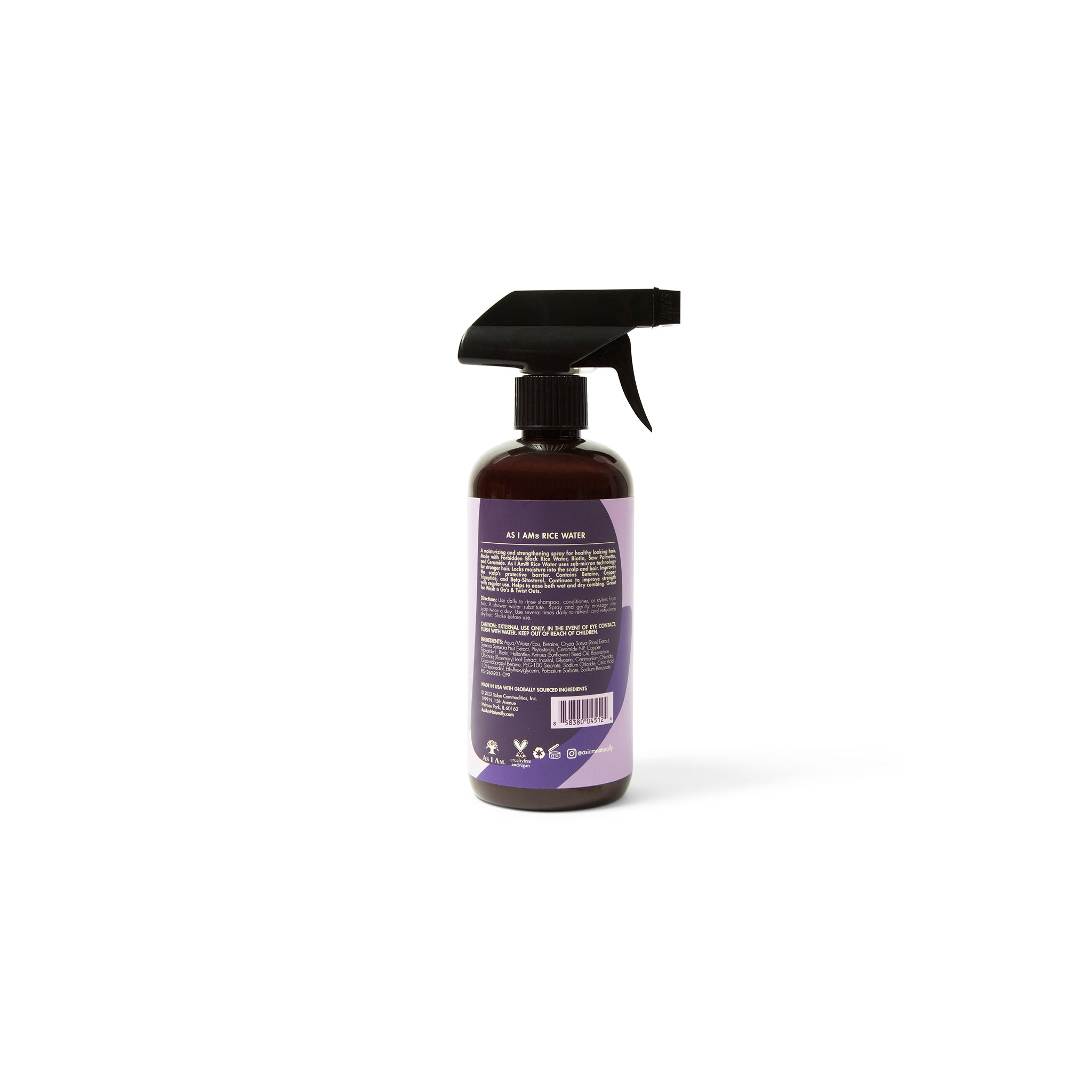 Bagsiden af en brun sprayflaske med sort sprayhoved, mærket As I Am Rice Water Spray (475 ml), der viser ingrediensliste, brugsanvisning og anden produktinformation.