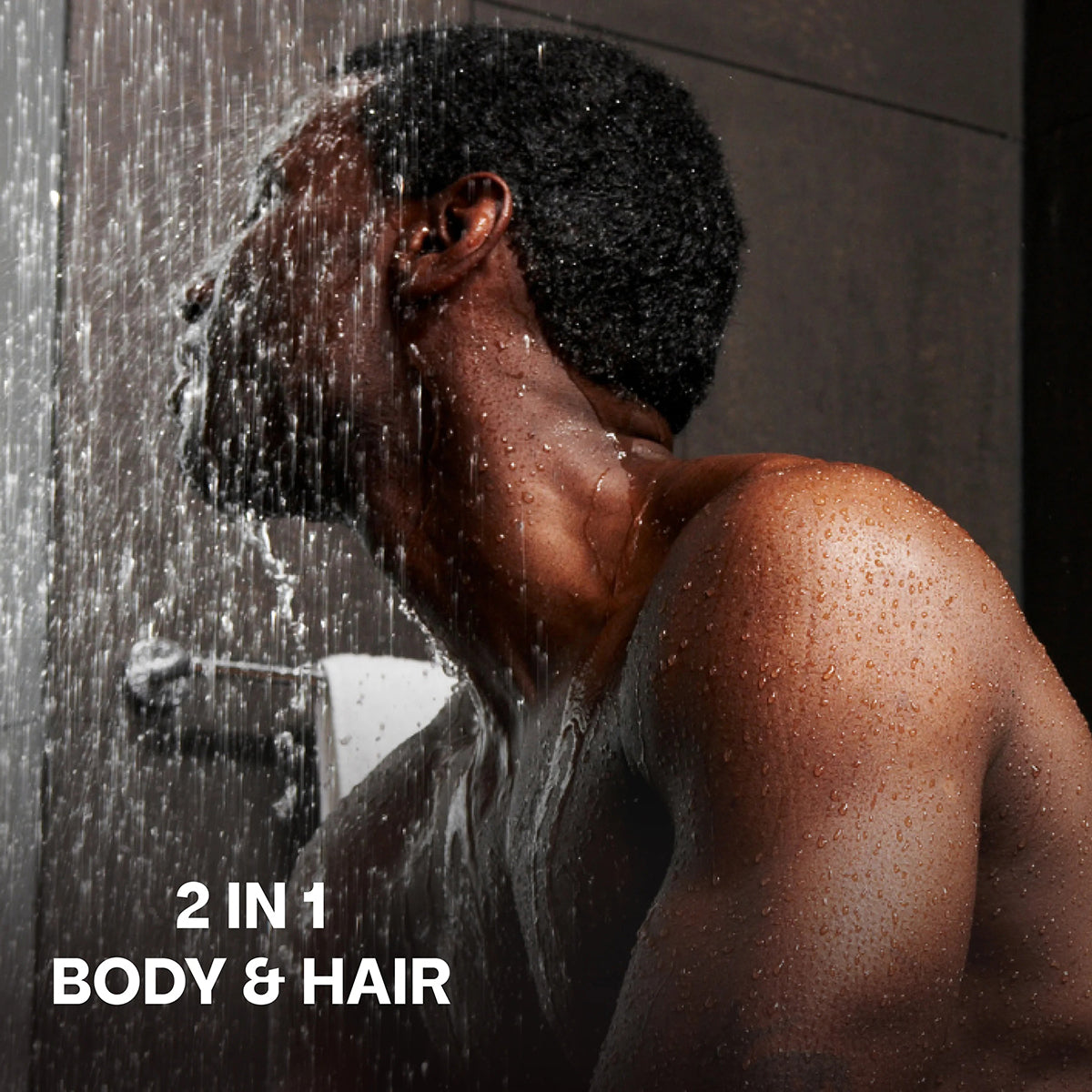 Man in the shower enjoys Bali Gents Shower Gel Sandalwood Leather 7 200ml for both body and hair.