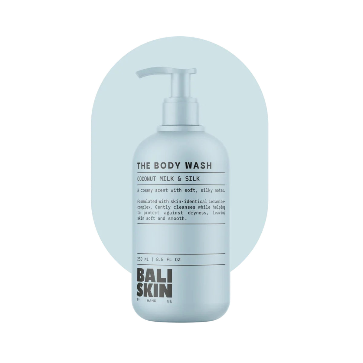 Bali Skin The Body Wash pumpeflaske med Coconut Milk & Silk duft, 250 ml, lyseblå baggrund.