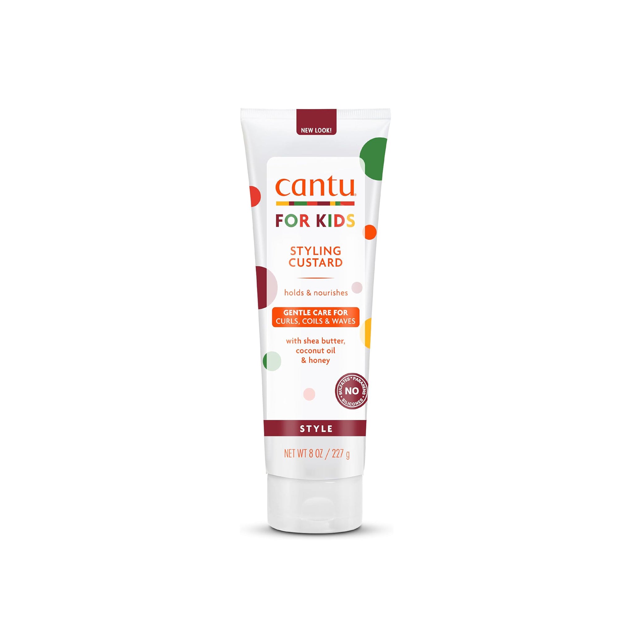 Hvid tube med grønne, orange og røde detaljer indeholdende Cantu For Kids Styling Custard.