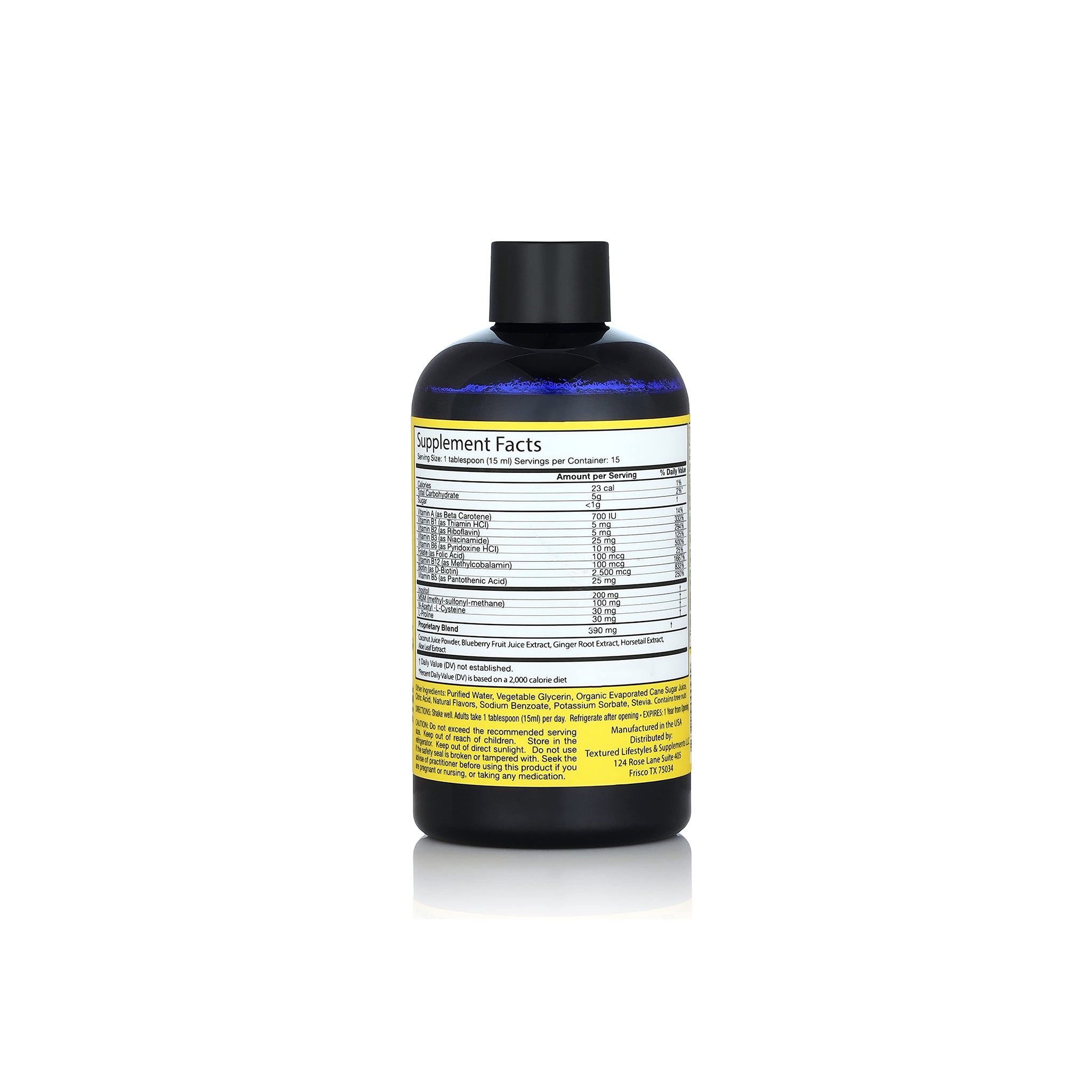 Nærbillede af bagsiden af en flaske Curls Blissful Lengths Liquid Hair Growth Vitamin, der viser "Supplement Facts" (næringsindhold).