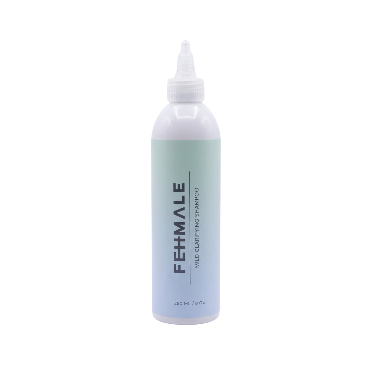 Hvid FEMALE Mild Clarifying Shampoo-flaske på 250 ml med twist-cap låg og mintgrøn-blå etikette.