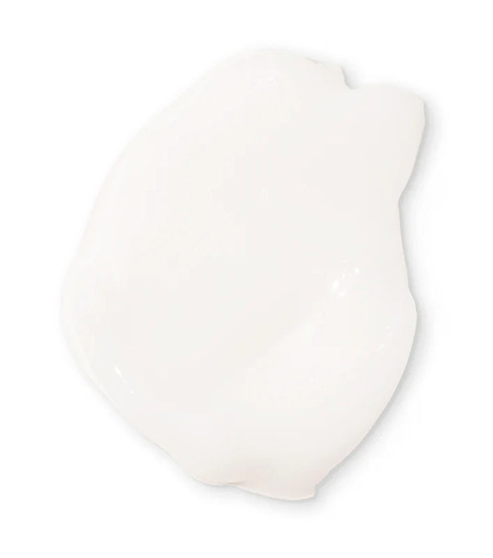 Hvid, cremet konsistens af Not Your Mother's Kids Curly Care Cream 237ml vist mod neutral baggrund.