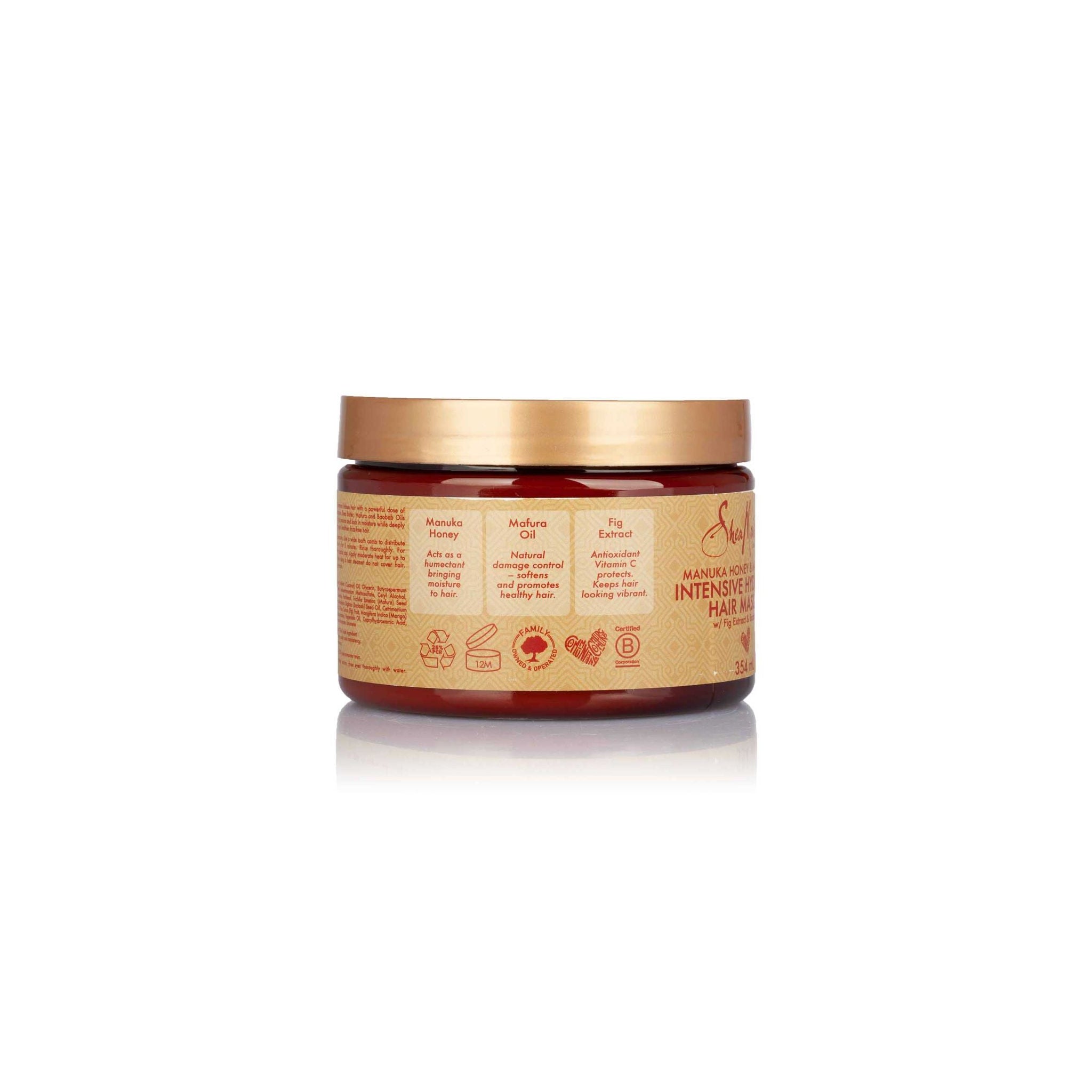 Bagside af Shea Moisture hårmaske (354 ml) med information om manuka honning, mafura olie og figenekstrakt, der bidrager til fugt, skadeskontrol og blødhed for sundt hår.