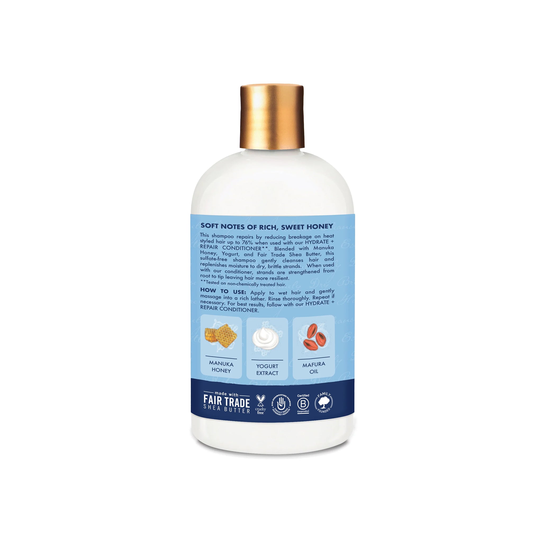 Bagside af Shea Moisture Manuka Honey & Yogurt Hydrate + Repair Shampoo (384 ml). Beskrivelse af fordele (mindsker brud), ingredienser (Manuka Honning, Yoghurt, Mafura Olie) og brugsanvisning.
