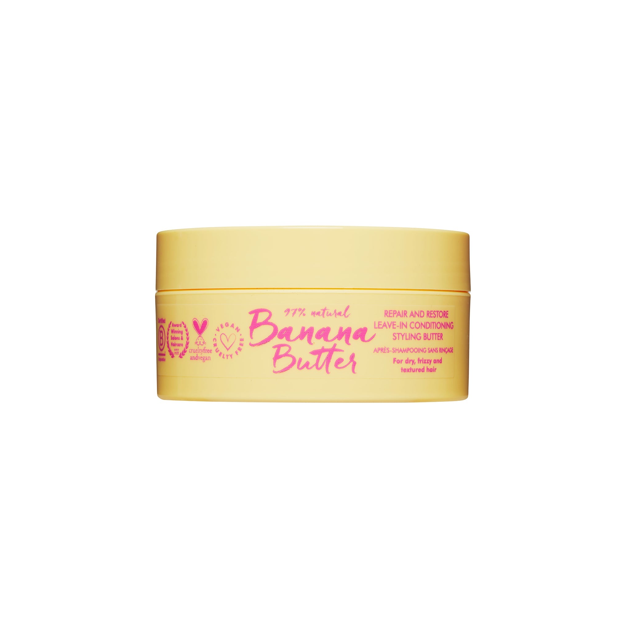 Lys gul beholder med Banana Butter leave-in conditioner til kruset og tørt hår, med tekst i pink på forsiden.