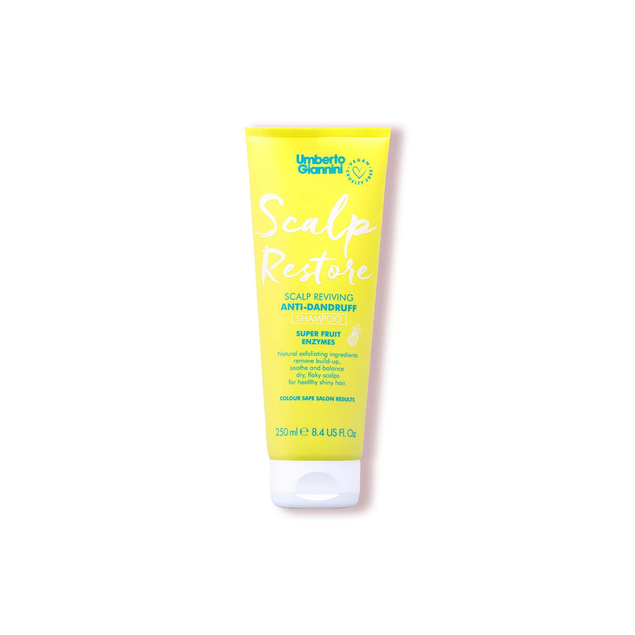 Gul tube med Umberto Giannini Scalp Restore anti-dandruff shampoo med superfruitenzymer til skinnende, sundt hår.